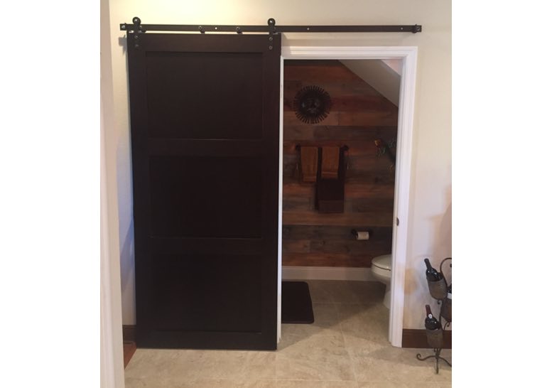 Brown bathroom sliding barn door 